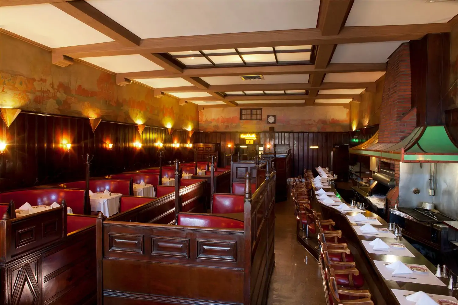 The interior of Hollywood restaurant The Musso & Frank Grill with red leather booths