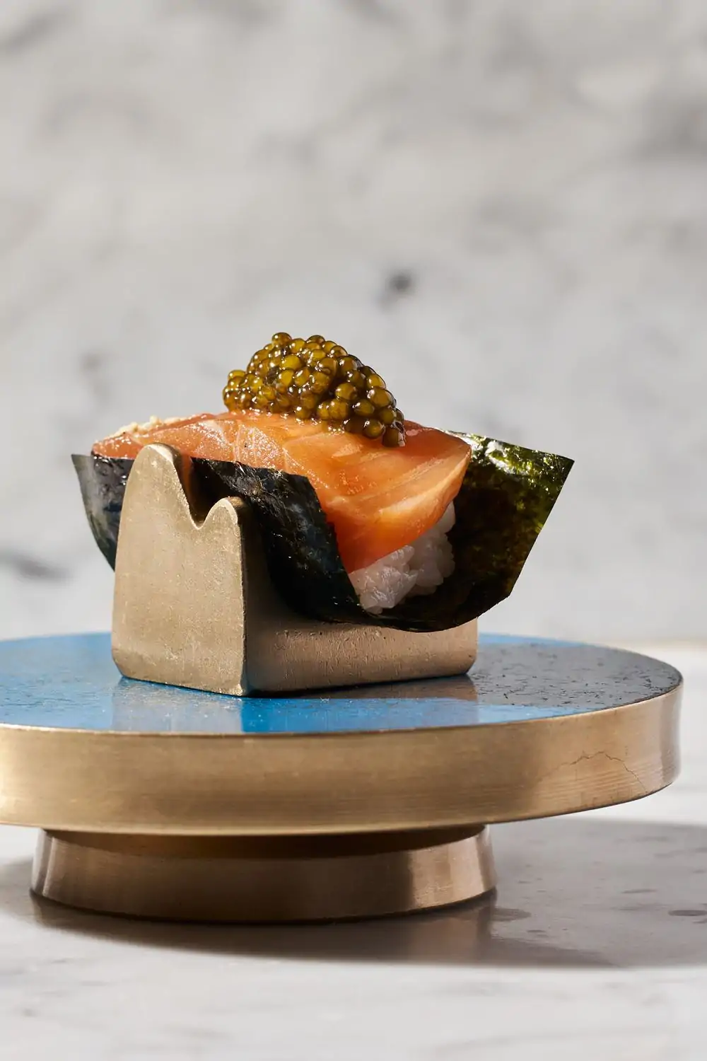 A handroll topped with Scottish salmon and caviar at Mari, one of the best Hell’s Kitchen restaurants in NYC on OpenTable.