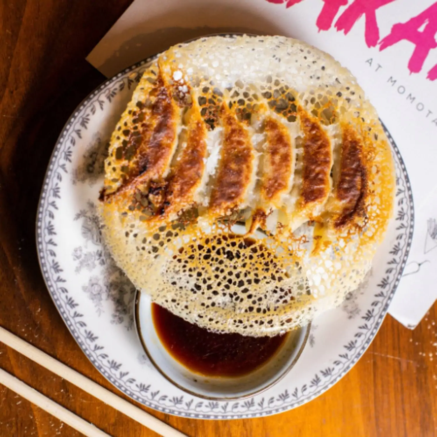 Crispy dumplings on a plate at Chicago restaurant The Izakaya at Momotaro