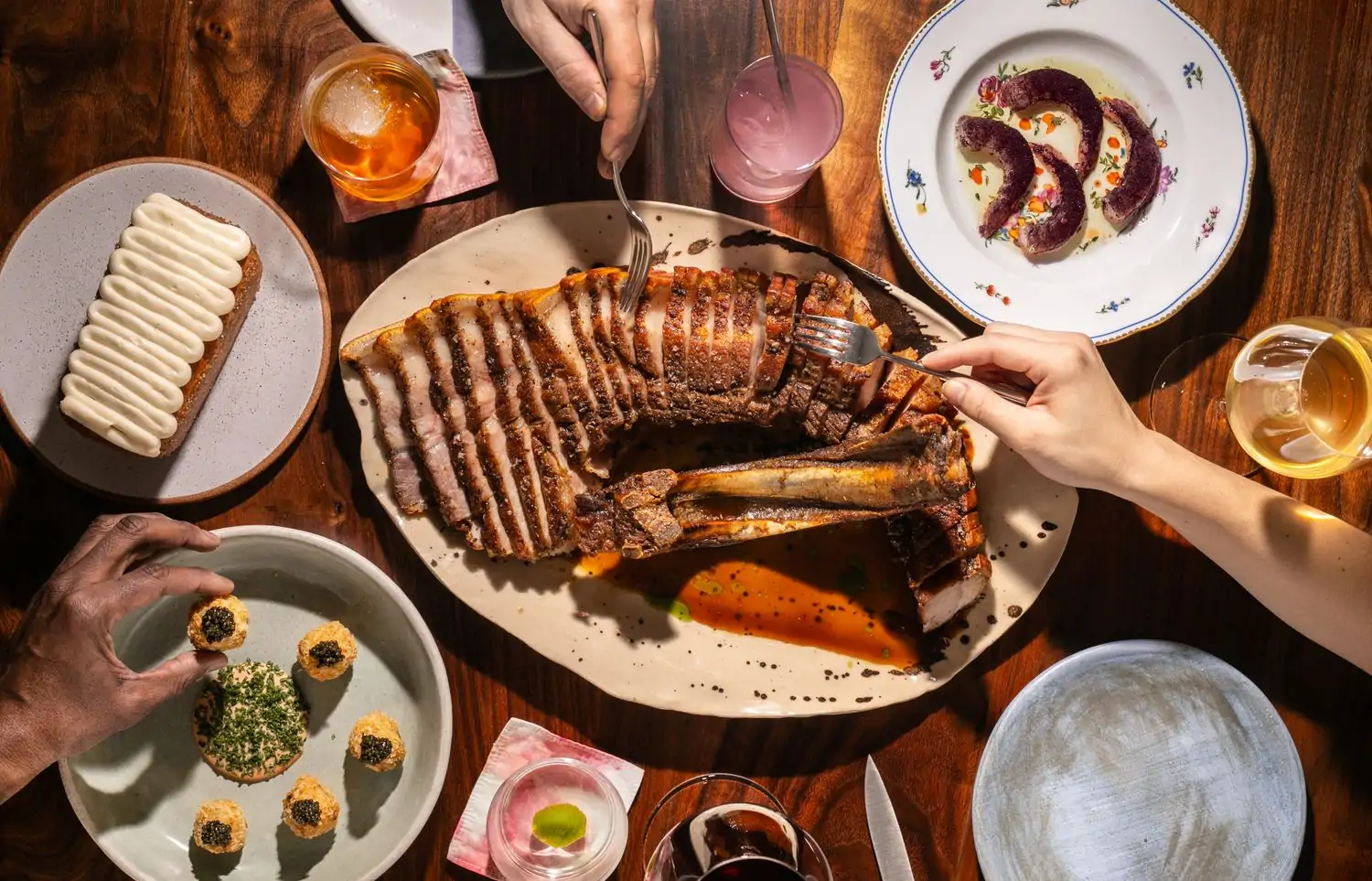 A spread of food on the table at New York Times 100 Best Restaurant list spot Kabawa