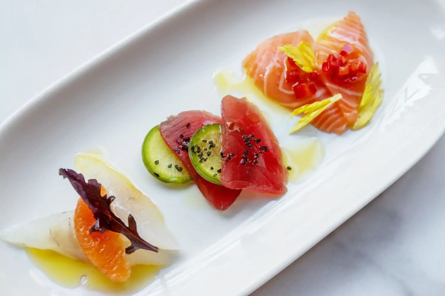 A close-up of crudo at Il Pesce, one of the best pescatarian restaurants in NYC, available on OpenTable.