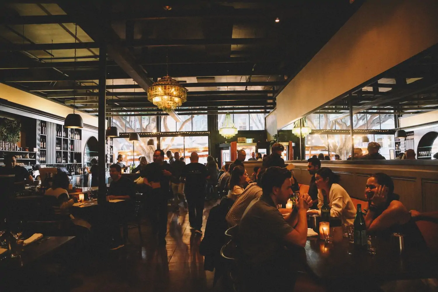 Several people seated in the dining room of San Francisco restaurant Seven Hills