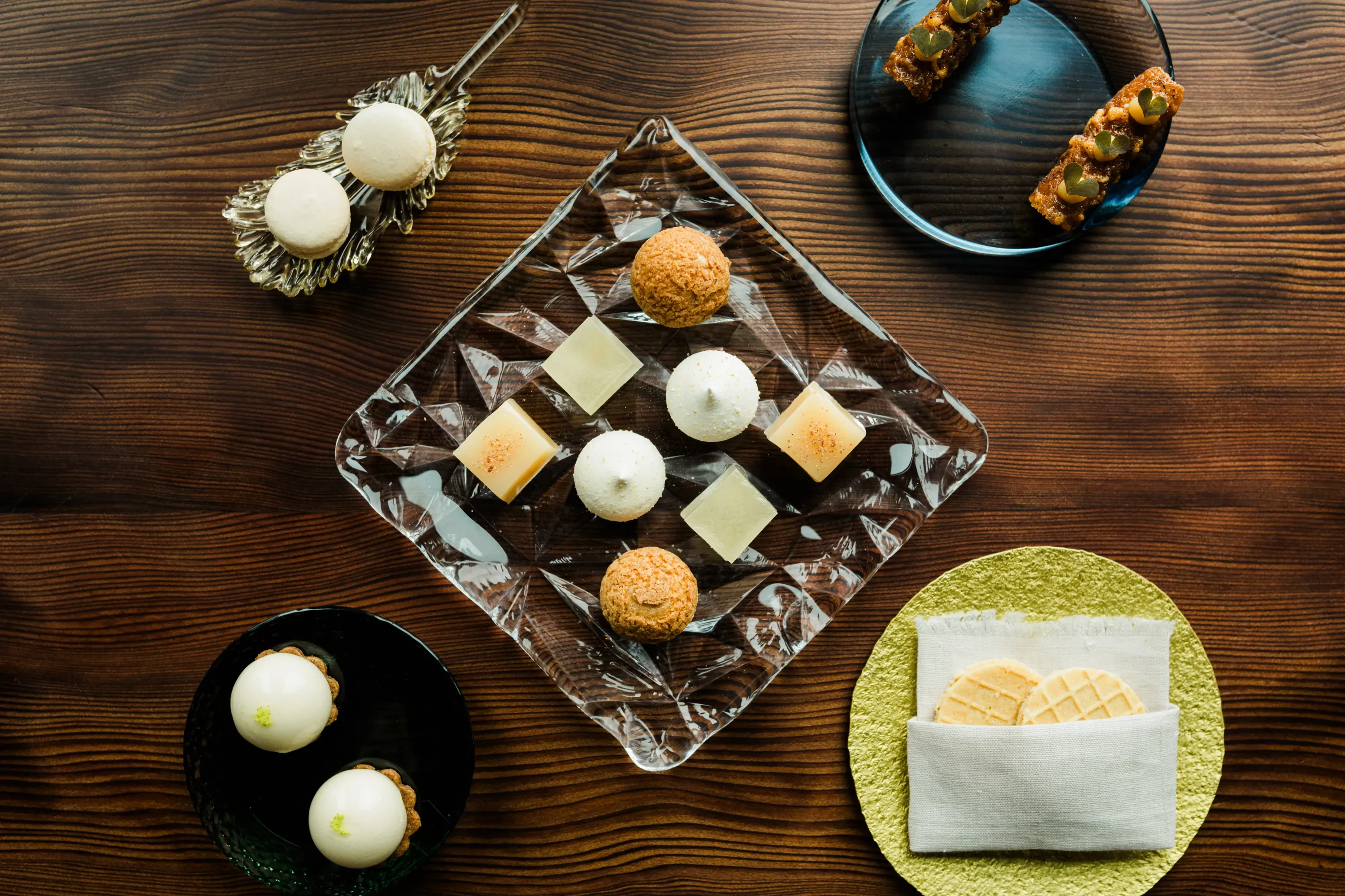 Several desserts on a wooden table at the Harbor House Inn restaurant
