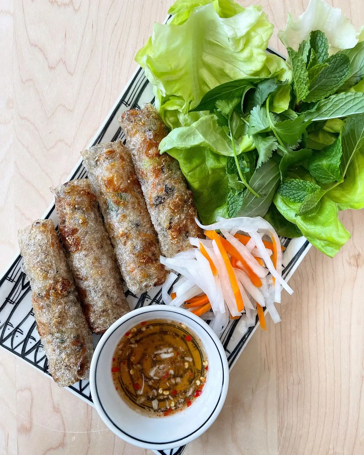 Overhead view of spring rolls from Sochi Saigonese Kitchen, one of the best restaurants in Lakeview, Chicago. Book on OpenTable.