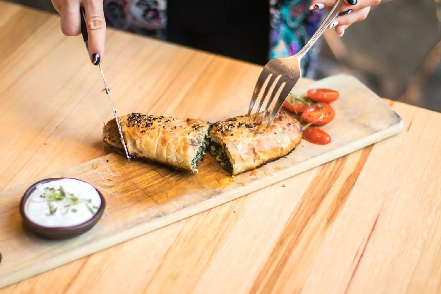 A Greek pastry dish is cut open at Avli on The Park in Downtown Chicago. Secure your seat on OpenTable.