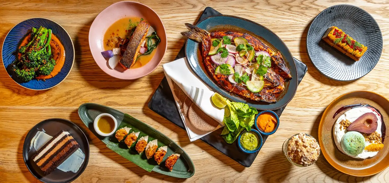 Aerial view of seafood dishes and desserts at Hav & Mar, one of the best seafood restaurants in NYC. Book on OpenTable.