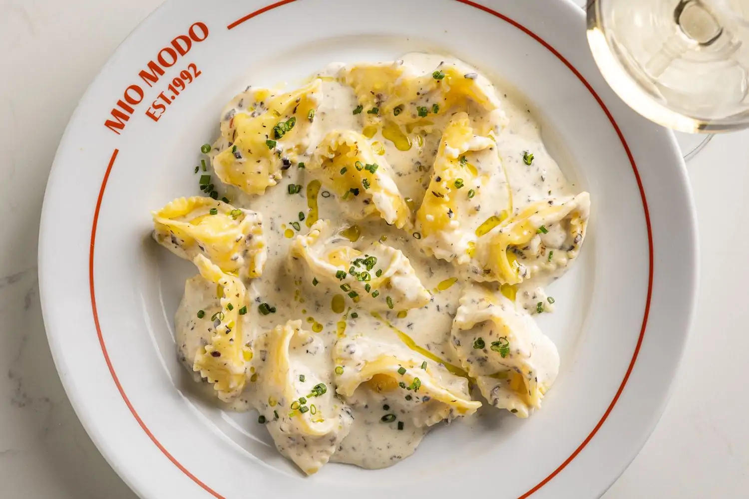 An overhead view of a creamy pasta dish from Mia Francesca in Lakeview, Chicago, on OpenTable.