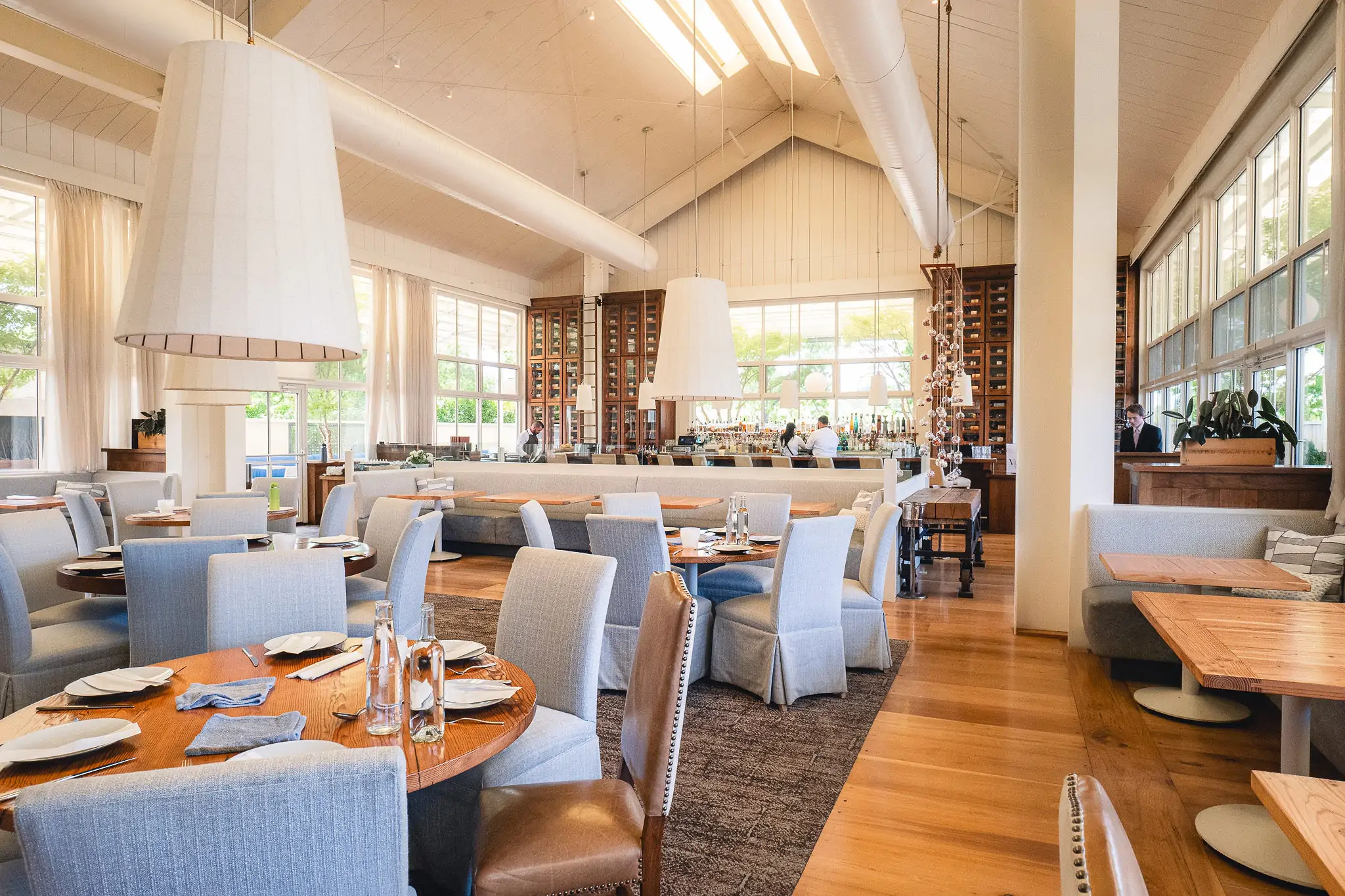 The interior of Napa restaurant PRESS seen here with high arched ceilings and wooden furnishings throughout