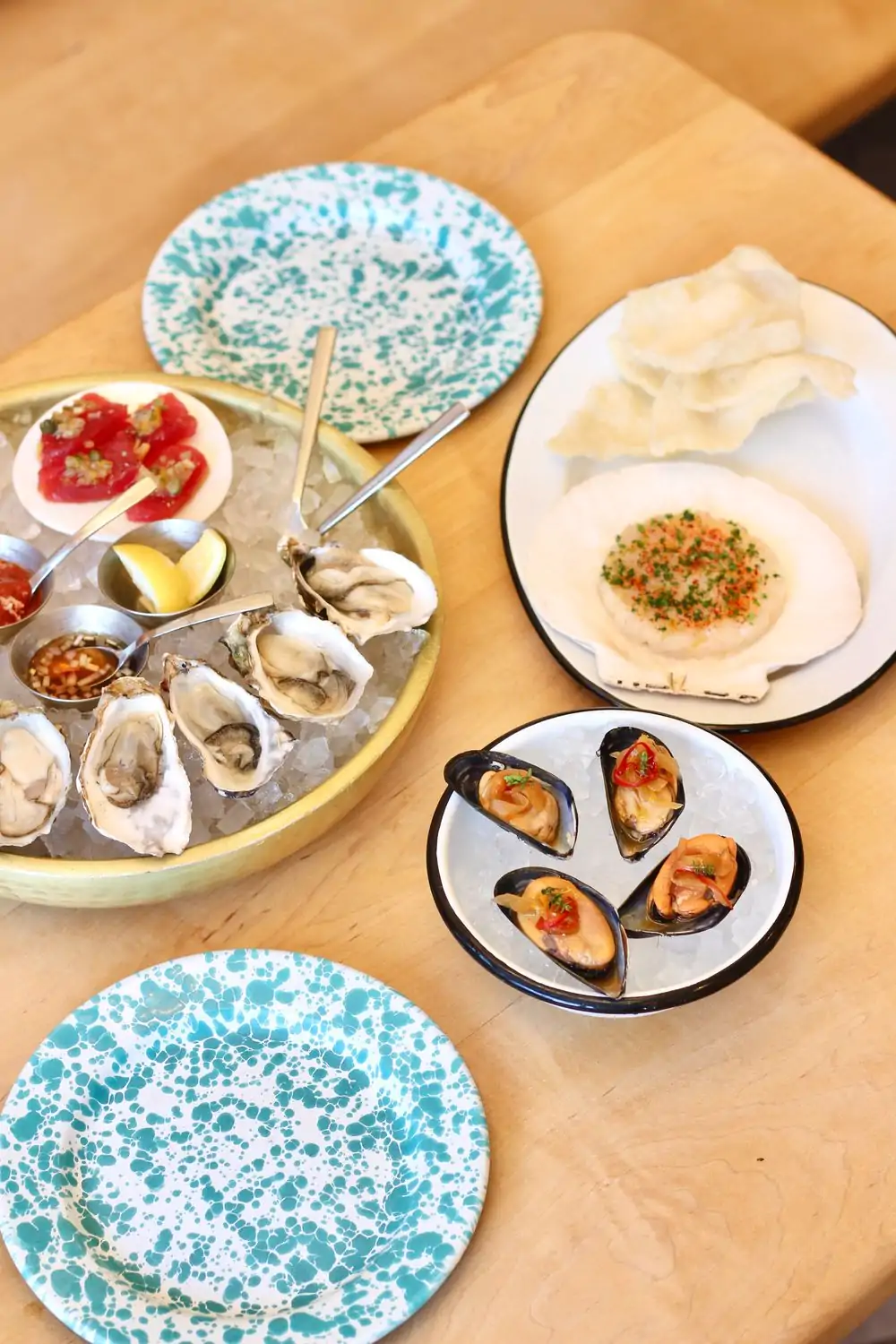 An overhead view of items from the raw bar at little shucker, one of the best restaurants in Pacific Heights, San Francisco, on OpenTable.