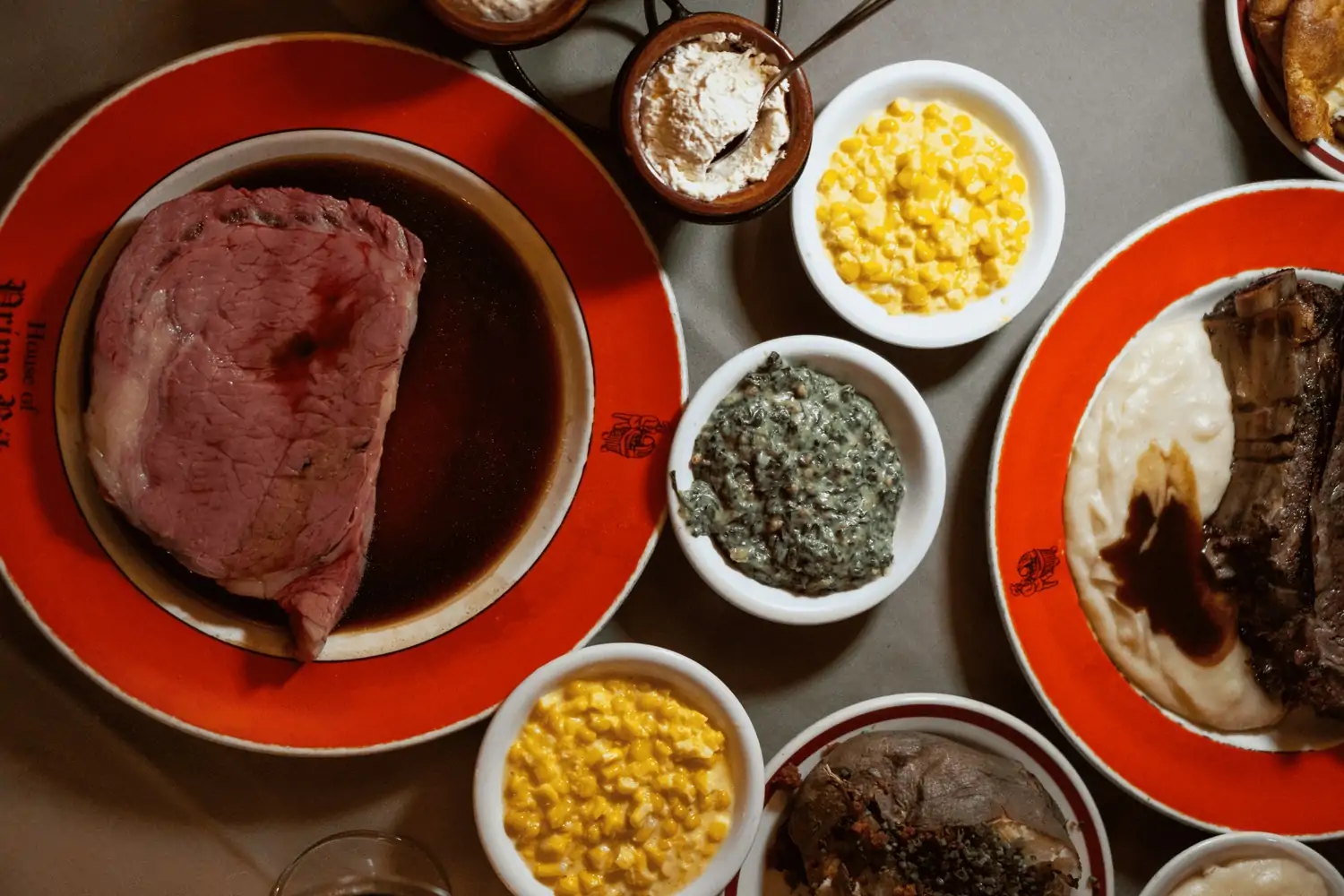 Prime rib on a plate next to sides at San Francisco restaurant House of Prime Rib