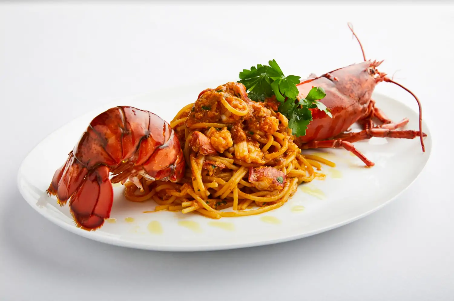 A lobster and pasta dish at Estiatorio Milos, one of the best seafood restaurants in midtown NYC. Book on OpenTable.