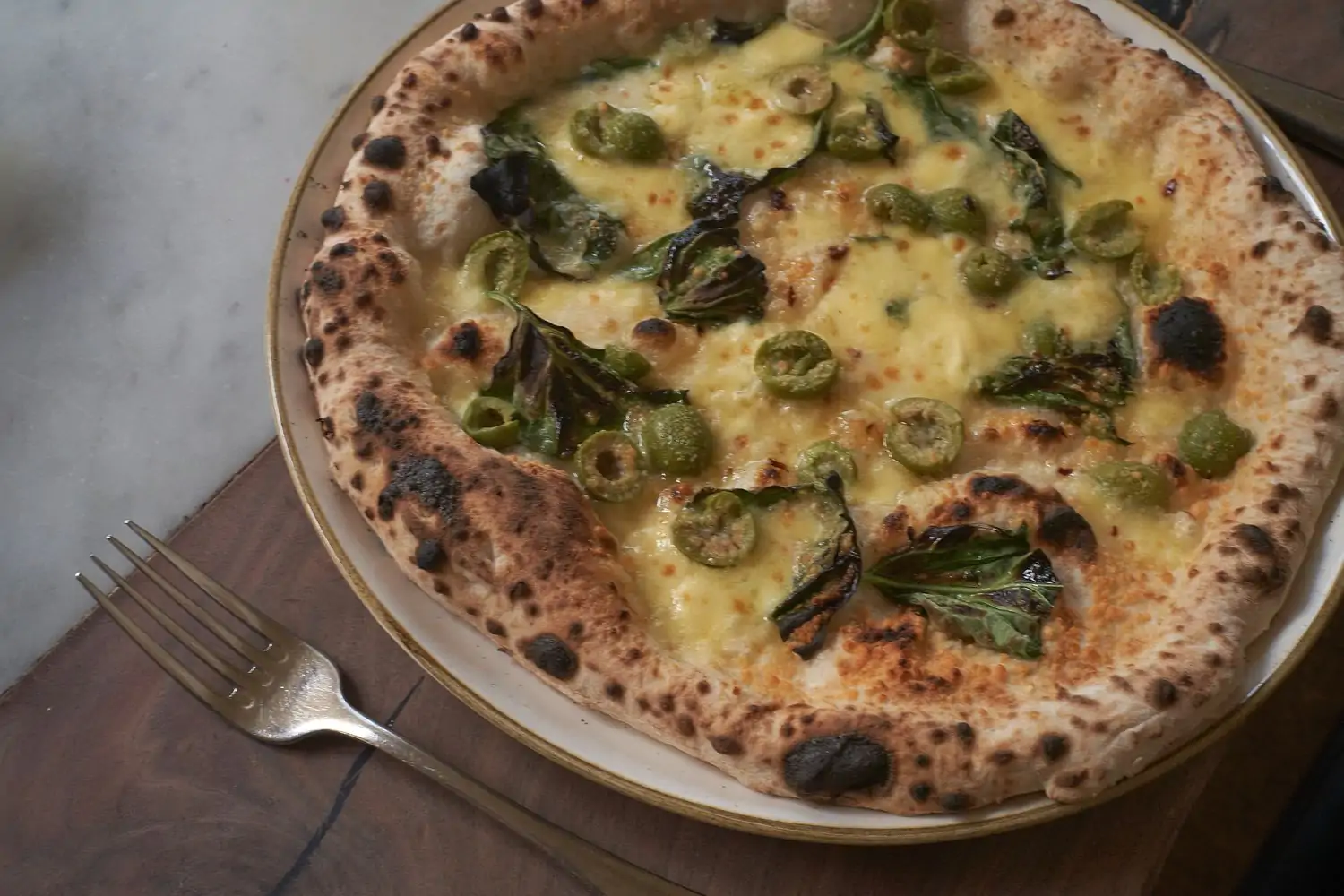 A pizza with olives at San Francisco restaurant A16