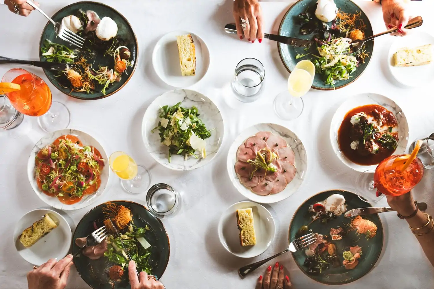 An overhead view of menu items from Zucca, top-spot private dining in Miami, available on OpenTable.