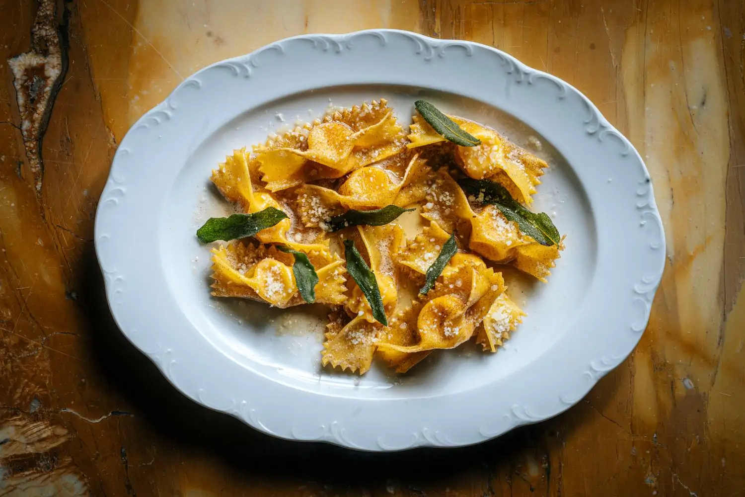 Handmade ravioli garnished with fried sage leaves at Tre Dita, one of the best hotel restaurants in Chicago, on OpenTable.