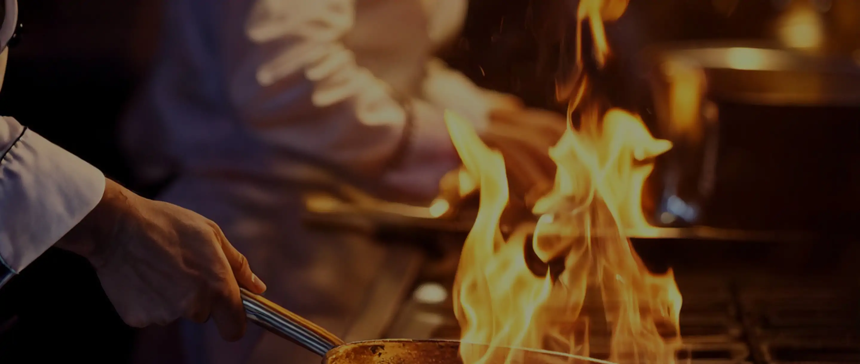 Firefly cinematic shot of chefs cooking on a restaurant kitchen line saute pan with dancing flame